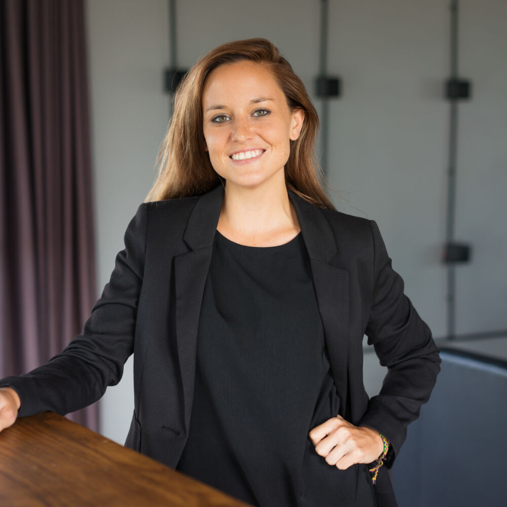 Happy Beautiful Business Woman at Reception Desk