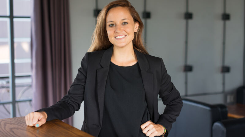 Happy Beautiful Business Woman at Reception Desk
