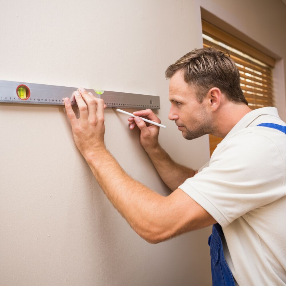 Construction worker using spirit level